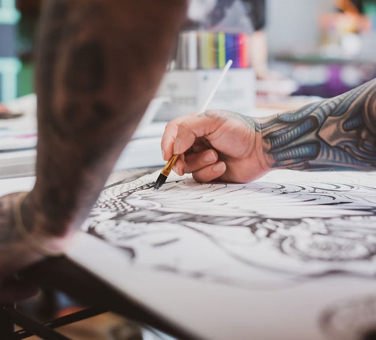 Tattoo Artist Making a Sketch Tattoo Artist Making a Sketch